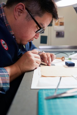 Library Of Congress conservation technician, Paul Kwan Asta. Photographed by Noah Willman for an editorial assignment in Washington, DC. `