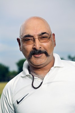 A portrait of a Washington Cricket League player during a match in Washington, DC. Photo by Noah Willman. `