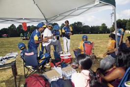 Players singing during a Sri Lankan cricket tournament in Germantown, MD. Photo by Noah Willman. `
